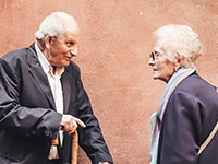old man and woman talking